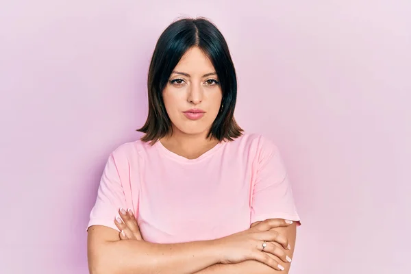 Young Hispanic Woman Wearing Casual Pink Shirt Skeptic Nervous Disapproving — Stockfoto