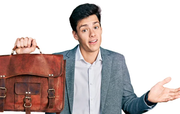 Young Hispanic Man Holding Business Bag Celebrating Achievement Happy Smile — Foto de Stock