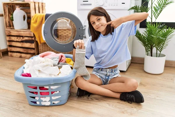 Young Hispanic Girl Doing Laundry Holding Socks Smiling Cheerful Showing — Foto Stock