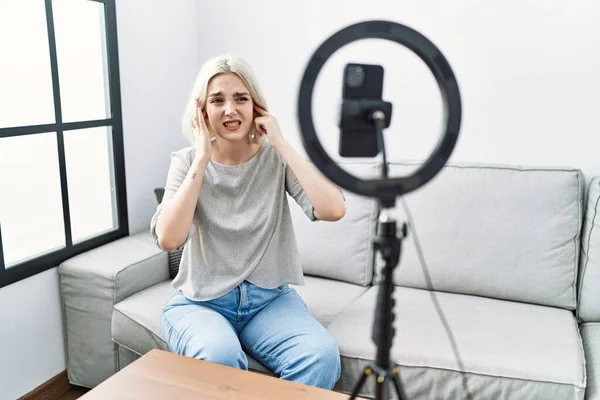 Young Caucasian Woman Recording Vlog Tutorial Smartphone Home Covering Ears — ストック写真