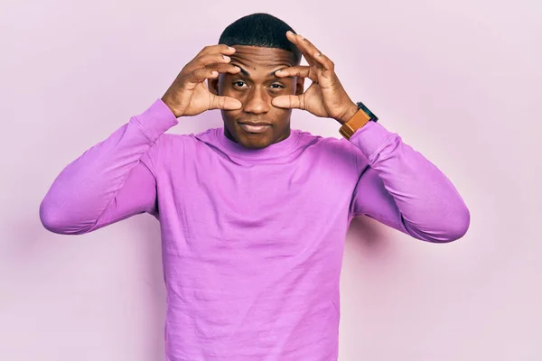 Young Black Man Wearing Casual Pink Sweater Trying Open Eyes — Stockfoto