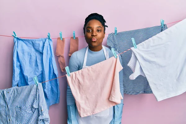 African American Woman Braided Hair Washing Clothes Clothesline Looking Camera — 图库照片