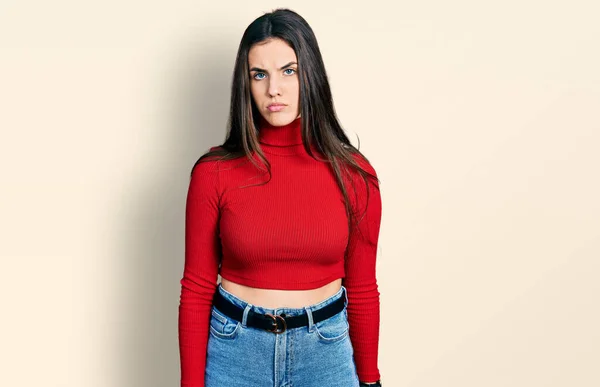 Young Brunette Teenager Wearing Red Turtleneck Sweater Looking Sleepy Tired — Stockfoto