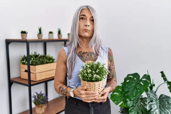 Middle Age Grey Haired Woman Holding Green Plant Pot Home Stock Photo by  ©Krakenimages.com 513675880