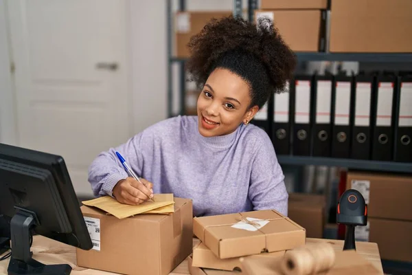 Young African American Woman Smiling Confident Writing Package Office — Stock Photo, Image