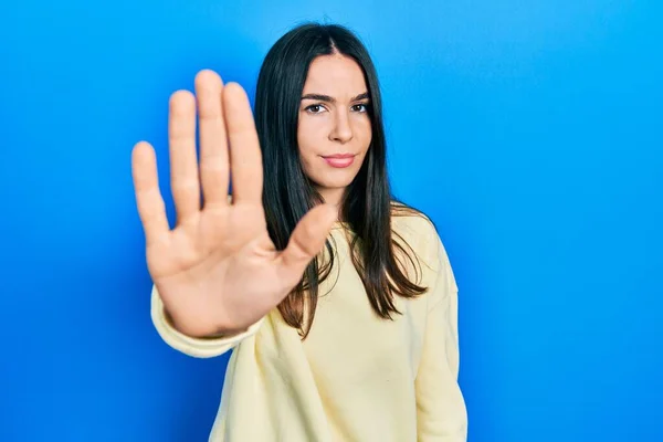 Young Brunette Woman Wearing Casual Sweatshirt Doing Stop Sing Palm — стоковое фото