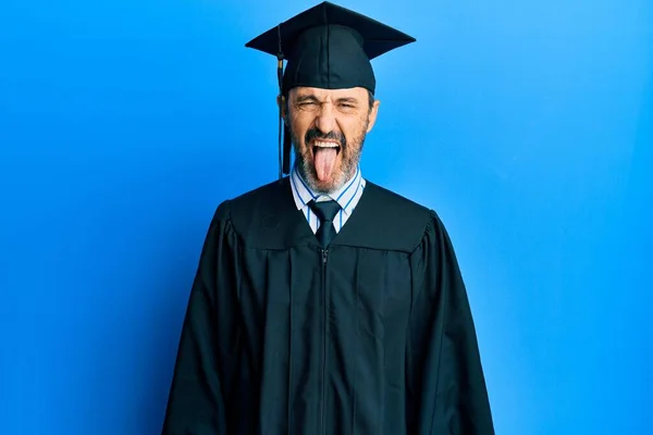 Middle Age Hispanic Man Wearing Graduation Cap Ceremony Robe Sticking — Foto Stock