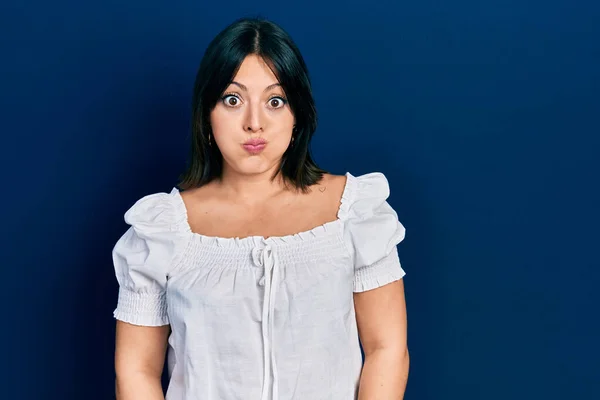 Young Hispanic Woman Wearing Casual Clothes Puffing Cheeks Funny Face — Stock Photo, Image