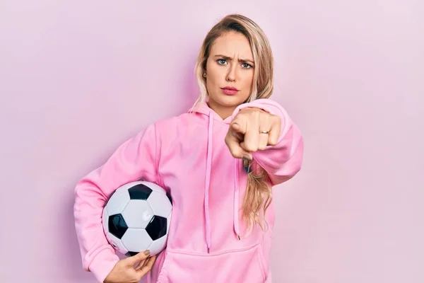 Beautiful Young Blonde Woman Holding Soccer Ball Pointing Finger Camera — Stock Photo, Image