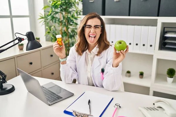 Young Woman Working Dietitian Clinic Sticking Tongue Out Happy Funny —  Fotos de Stock