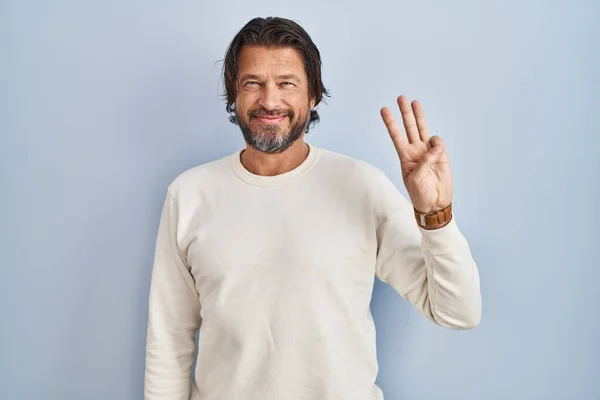Handsome Middle Age Man Wearing Casual Sweater Blue Background Showing — Zdjęcie stockowe