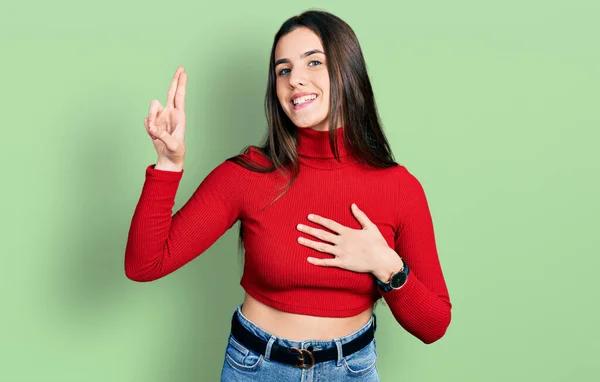 Young Brunette Teenager Wearing Red Turtleneck Sweater Smiling Swearing Hand — Photo
