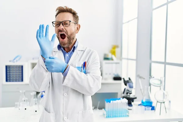 Middle Age Man Working Scientist Laboratory Angry Mad Screaming Frustrated — Zdjęcie stockowe