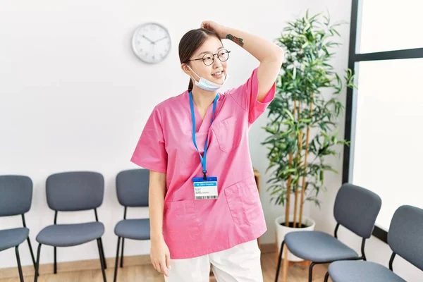 Young Asian Nurse Woman Medical Waiting Room Smiling Confident Touching —  Fotos de Stock