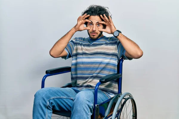 Handsome Hispanic Man Sitting Wheelchair Trying Open Eyes Fingers Sleepy — Foto Stock