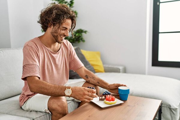 Young Hispanic Man Having Breakfast Sitting Sofa Home — Stock Photo, Image