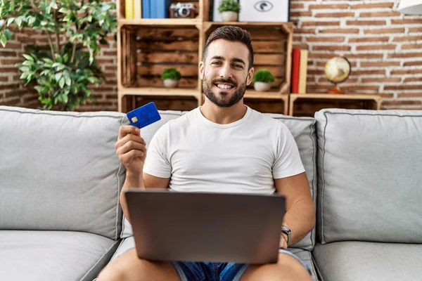 Handsome Hispanic Man Doing Online Shopping Holding Credit Card Looking — Stock fotografie