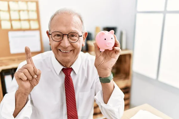 Senior Business Man Holding Piggy Bank Surprised Idea Question Pointing — Stock Photo, Image