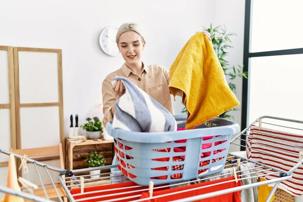 Young Caucasian Woman Smiling Confident Holding Clothes Basket Laundry Room — Stockfoto