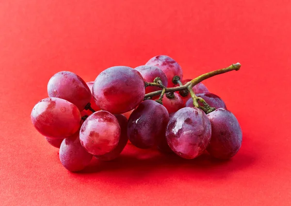 Bunch Grapes Red Background — стоковое фото