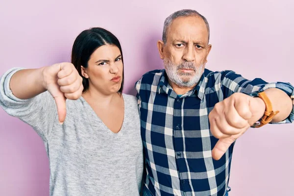 Hispanic Father Daughter Wearing Casual Clothes Looking Unhappy Angry Showing — стоковое фото