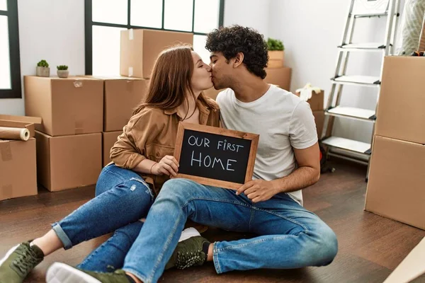 Young Couple Smiling Happy Holding Blackboard Our First Home Message — Stock Photo, Image