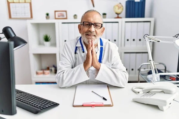 Mature Doctor Man Clinic Praying Hands Together Asking Forgiveness Smiling — 스톡 사진