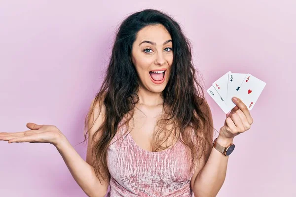 Young Hispanic Woman Holding Poker Cards Celebrating Achievement Happy Smile — Stock Photo, Image