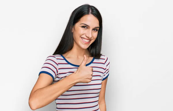 Young Hispanic Girl Wearing Casual Striped Shirt Doing Happy Thumbs — Stockfoto