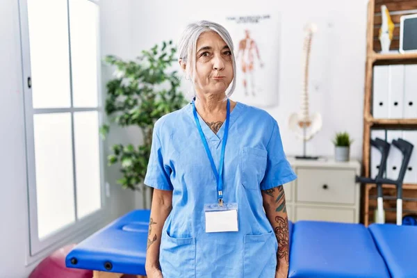 Middle Age Grey Haired Woman Wearing Physiotherapist Uniform Medical Clinic —  Fotos de Stock