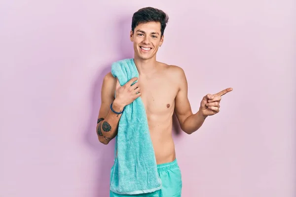 Young Hispanic Man Wearing Swimwear Towel Smiling Happy Pointing Hand — Stock Photo, Image