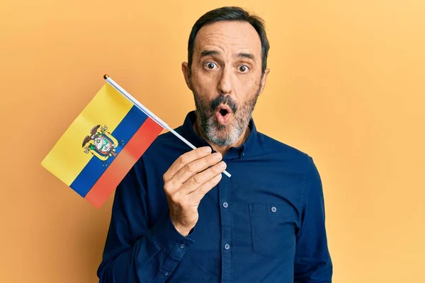 Middle Age Hispanic Man Holding Ecuador Flag Scared Amazed Open — Photo