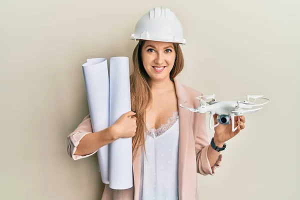 Young Blonde Woman Wearing Safety Helmet Holding Blueprints Drone Smiling — Stock Photo, Image