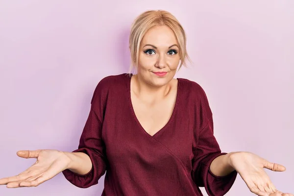 Young Blonde Woman Wearing Casual Winter Sweater Clueless Confused Expression —  Fotos de Stock