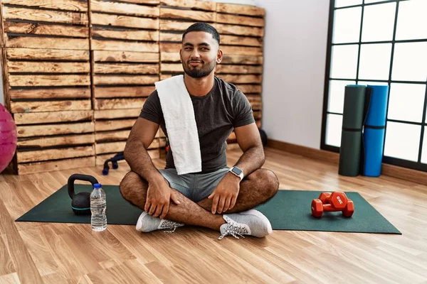 Young Indian Man Sitting Training Mat Gym Smiling Looking Side — Stok fotoğraf