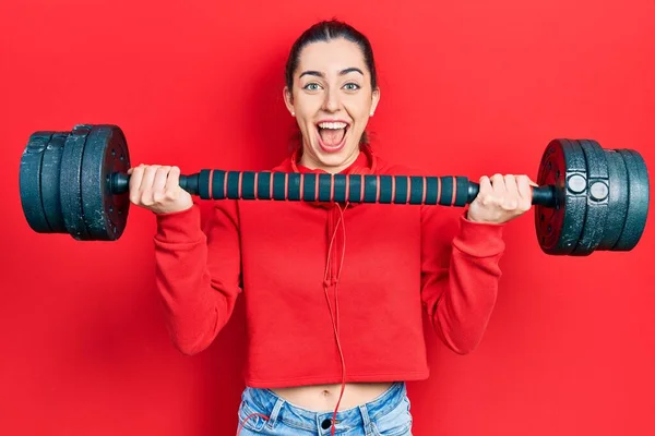 Beautiful Woman Blue Eyes Wearing Sportswear Using Dumbbells Celebrating Crazy — Stock Photo, Image