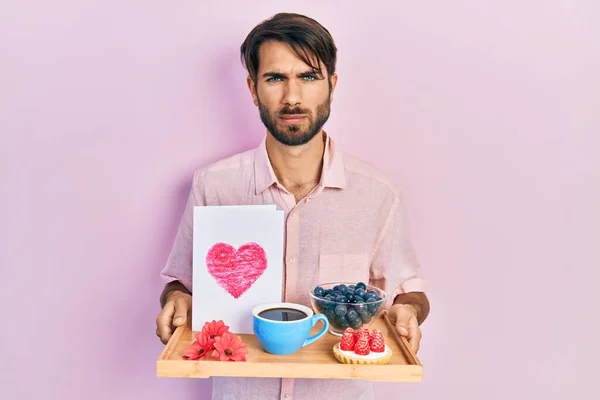 Young Hispanic Man Holding Tray Breakfast Food Heart Draw Skeptic — Stock Photo, Image