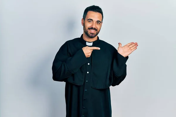 Handsome Hispanic Man Beard Wearing Catholic Priest Robe Amazed Smiling — Stok fotoğraf