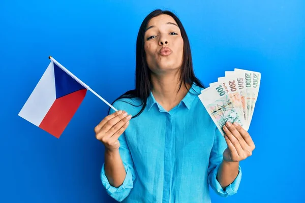Young Latin Woman Holding Czech Republic Flag Koruna Banknotes Looking —  Fotos de Stock