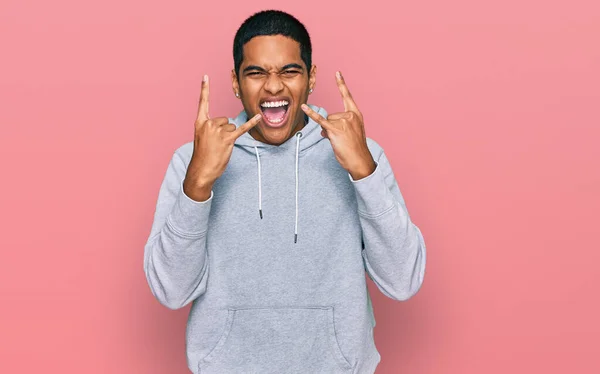 Young Handsome Hispanic Man Wearing Casual Sweatshirt Shouting Crazy Expression — Stock Photo, Image