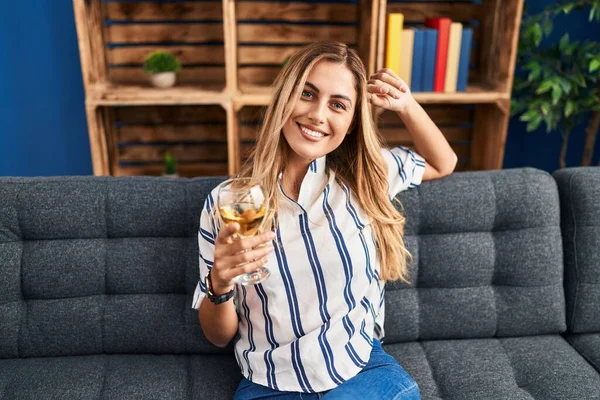 Young Blonde Woman Drinking Champagne Sitting Sofa Home — Fotografia de Stock
