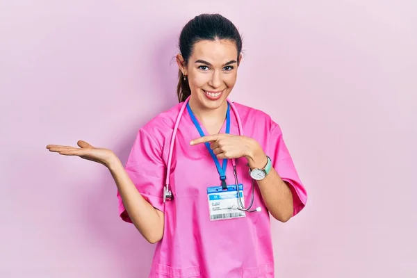 Young Brunette Woman Wearing Doctor Uniform Stethoscope Amazed Smiling Camera — Stok fotoğraf