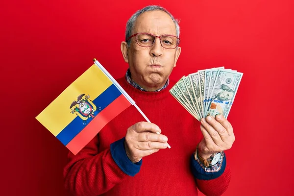 Handsome Senior Man Grey Hair Holding Ecuador Flag Dollars Puffing — Foto de Stock
