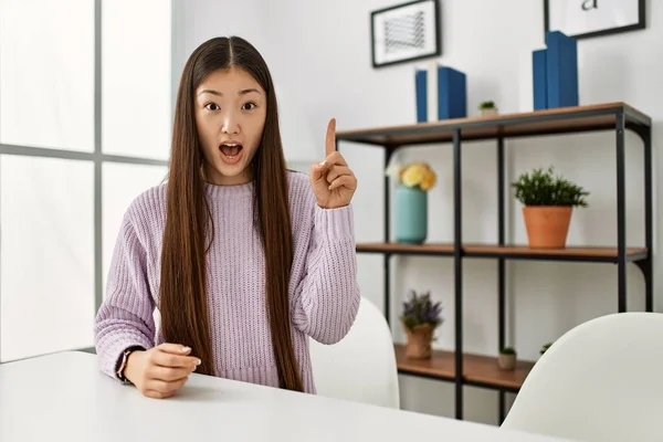 Young Chinese Girl Wearing Casual Clothes Sitting Table Home Pointing — Stock Photo, Image