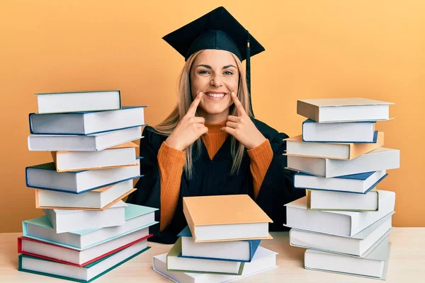 Young Caucasian Woman Wearing Graduation Ceremony Robe Sitting Table Smiling — Stock Fotó