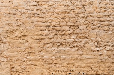  Boyanmış sarı tuğla duvar yüzey arkaplanı 