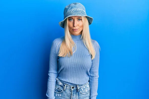 Young Blonde Woman Wearing Casual Denim Hat Relaxed Serious Expression — Fotografia de Stock