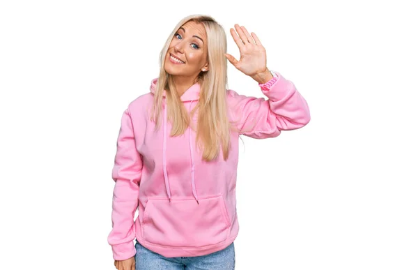 Young Blonde Woman Wearing Casual Sweatshirt Waiving Saying Hello Happy — Photo