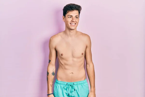 Young Hispanic Man Wearing Swimwear Shirtless Looking Away Side Smile — Stock Photo, Image