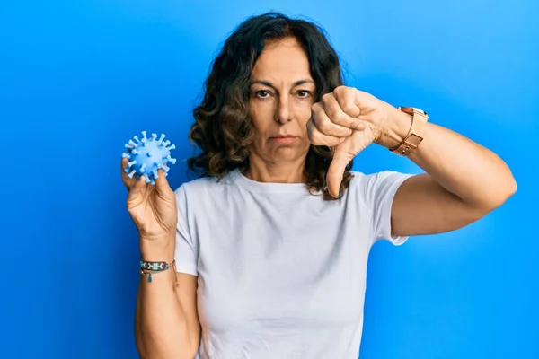 Middle Age Hispanic Woman Holding Virus Toy Angry Face Negative — Stock fotografie